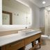 Element Austin Round Rock bathroom with double vanity, mirror, and glass-enclosed shower in Round Rock