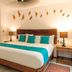 Casa Ticul Hotel By Bfh in Playa del Carmen, guest room with king bed and turquoise accents