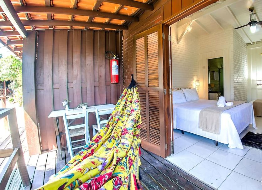 Pousada Rosa in Praia do Rosa balcony with hammock and open bedroom interior