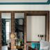 Hôtel Aoriste & Spa Paris room with mirrored wall, lounge chair, desk, and leather bag on bed