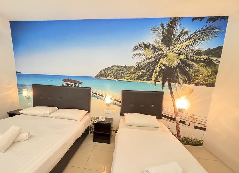 Best View Hotel Sunway Mentari guest room with twin beds and tropical beach mural in Petaling Jaya