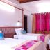 Kadambavanam Ethnic Village Resort, Madurai: twin beds and colorful curtains in a guest room