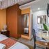 Javilla Eagles Safari Guest house Nairobi bedroom with bed, wardrobe, desk and bathroom vanity