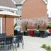 Outdoor patio at Residence Inn by Marriott Portsmouth with seating and grill