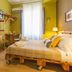 Miro Bed and Breakfast in Catania guest room with wooden bed, TV, luggage bench, and window