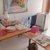 Eden Beach Saint-Louis breakfast table with tea setup, water bottles, cups and plates in a simple room