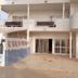 Eden Beach Saint-Louis exterior with balconies, columns, and gated ground-floor entrance
