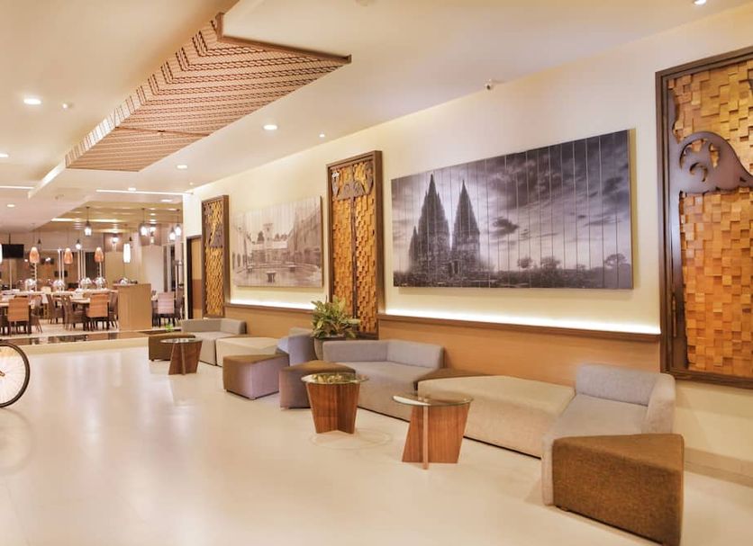 H Boutique Hotel Jogjakarta lobby lounge with seating and bicycle display in Yogyakarta