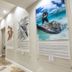 Guy Harvey Resort on Saint Augustine Beach hallway with marine artwork and bright ceiling lights