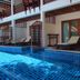 Blue Diamond Resort, Ko Tao: poolside loungers beside a tiled swimming pool and wooden terrace