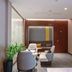 Home Inn Plus Foshan Shunde Qinghui Garden Rt-Mart lounge area with seating and wood-paneled wall in Foshan