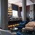 The Wellem Düsseldorf lounge with velvet chairs, bar seating and glass tables in a stylish interior