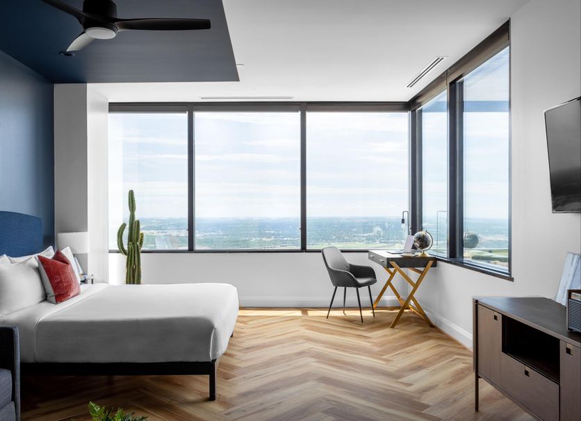 Mint House Dallas Downtown By Kasa guest room with city view, large windows, desk and bed in Dallas