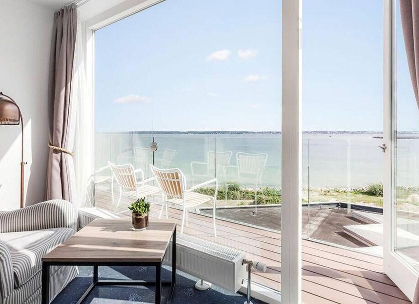 Marienlyst Strandhotel in Helsingør room with balcony and sea view through open glass doors