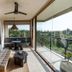 Soulshine Bali, Ubud: balcony lounge with daybed, dining nook and palm-tree views