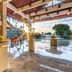 Discovery Kartika Plaza Hotel in Kuta: open-air lobby with poolside view and sunset light