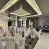 TIME Grand Plaza Hotel Dubai event hall with round banquet tables and white chair covers