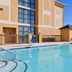 Holiday Inn Express & Suites Cordele North By IHG poolside view with outdoor pool and hotel exterior