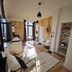 La Maison Grivolas in Avignon: stylish guest room with seating area, patterned rug, and open wardrobe
