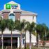 Holiday Inn Express & Suites Orlando - Apopka By IHG exterior with palm trees and blue sky