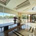 Hangzhou Sailing International Hotel lobby with long table, benches, floor-to-ceiling windows and tennis court view