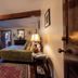 Gregory House Country Inn in Averill Park guest room with four-poster bed, area rug, and bedside lamp