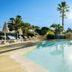 Pierre & Vacances Residence Cannes Mandelieu pool with palm trees in Mandelieu-la-Napoule