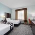 La Quinta Inn & Suites by Wyndham Bonita Springs Naples N. guest room with two beds and window