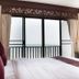 Sea Memories White Sand Beach Hotel in Hua Hin room with ocean-view balcony and king bed