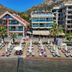 Orsmaris Boutique Hotel in Marmaris with beachfront loungers, pool and mountain backdrop