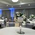 Delta Hotels by Marriott Waltham Abbey banquet hall with round tables and white floral centerpieces