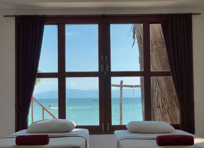 Phangan Great Bay Resort in Ko Pha Ngan with twin beds facing a sea view through large windows