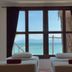 Phangan Great Bay Resort in Ko Pha Ngan with twin beds facing a sea view through large windows
