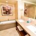 Holiday Inn Express & Suites Las Vegas Sw Springvalley bathroom with soaking tub, double sinks and large mirror