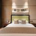 The Purple Palace Nanjing bedroom with king bed, padded headboard, and bedside tables in Nanjing