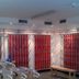 First Mountain Montafon in Gaschurn, ski room with red drying racks and a wooden bench
