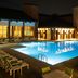 Lincolnshire Marriott Resort outdoor pool at night with lounge chairs and lit hotel windows in Lincolnshire