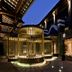 Guanyin Yiyuntai Hotel Chengdu courtyard with illuminated cylindrical pavilion and stone walkway at night