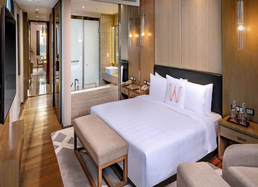 Welcomhotel By ITC Hotels, Richmond Road, Bengaluru guest room with king bed, seating area and bathroom view