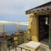 Il Borgo di Campi in Riomaggiore, terrace with sea view, railing, and entrance by posted notices