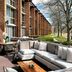 Lincolnshire Marriott Resort patio with sectional seating and dining tables beside a brick hotel exterior