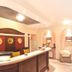 Villa Ambrosina in Impruneta reception desk with arched ceiling, seating, and potted plant