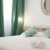 Aparthotel Fleming 50 - Adults Only room in Sant Antoni de Portmany with bed, mint pillows and rolled towels