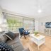 Riverwatch Apartments By Lowkl in Jensen Beach living room with balcony view and TV