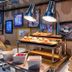 Breakfast buffet at Tinidee Trendy Bangkok Khaosan in Bangkok with pastries, fruit, and warming lamps