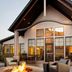 Residence Inn by Marriott Lincoln South exterior with fire pit and outdoor lounge seating at dusk