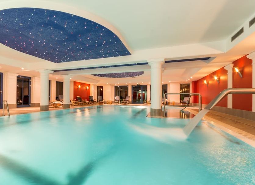 Badehaus Goor in Putbus indoor pool with starry blue ceiling and white columns