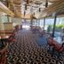 Stord Folkehøgskule Sommarhotell Leirvik dining area with large windows and patterned carpet
