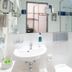 Hotel Jean-Paul bathroom with sink, mirror, and glass walk-in shower in Schwarzenbach an der Saale