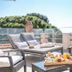 Hotel Mas Djoliba, Antibes: rooftop terrace with lounge chairs, breakfast tray, and sea view